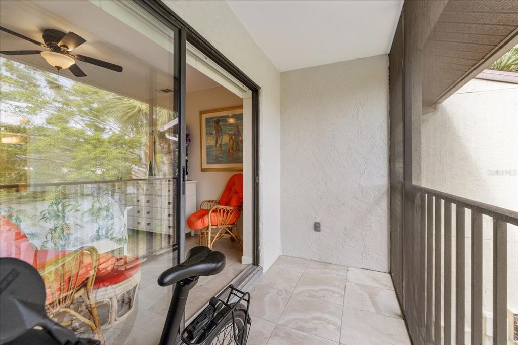 748 White Pine Tree Road, Unit 204 Venice, FL 34285 - Photo 17 of 48 a view of a room with wooden floor and windows