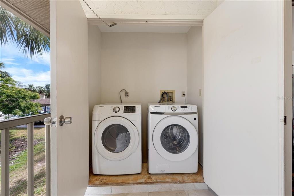 748 White Pine Tree Road, Unit 204 Venice, FL 34285 - Photo 18 of 48 a utility room with dryer and washer