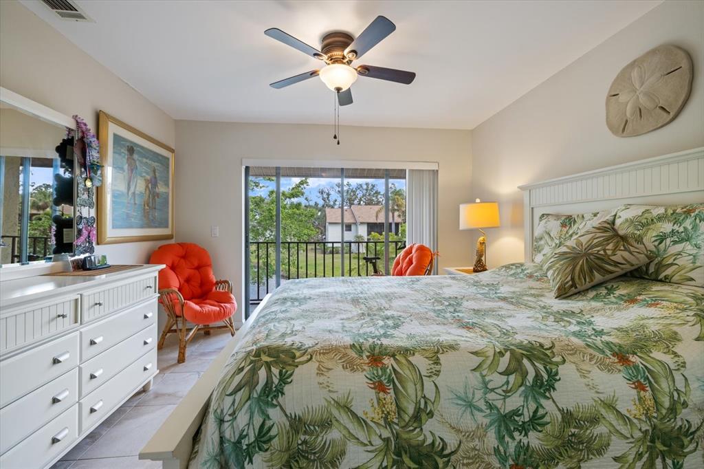 748 White Pine Tree Road, Unit 204 Venice, FL 34285 - Photo 20 of 48 a bed sitting in a bedroom next to a window