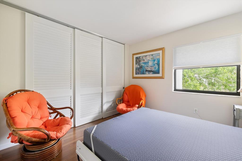 748 White Pine Tree Road, Unit 204 Venice, FL 34285 - Photo 27 of 48 a bed room with a bed and a chair