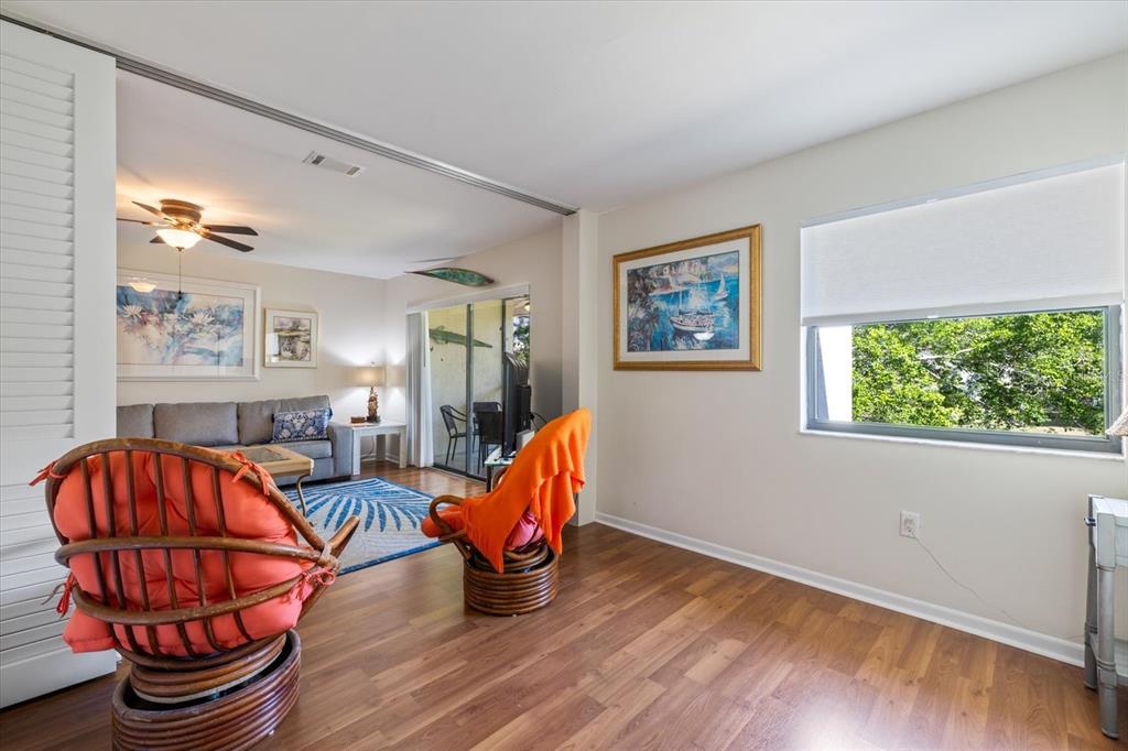 748 White Pine Tree Road, Unit 204 Venice, FL 34285 - Photo 29 of 48 a living room with furniture a rug and a window