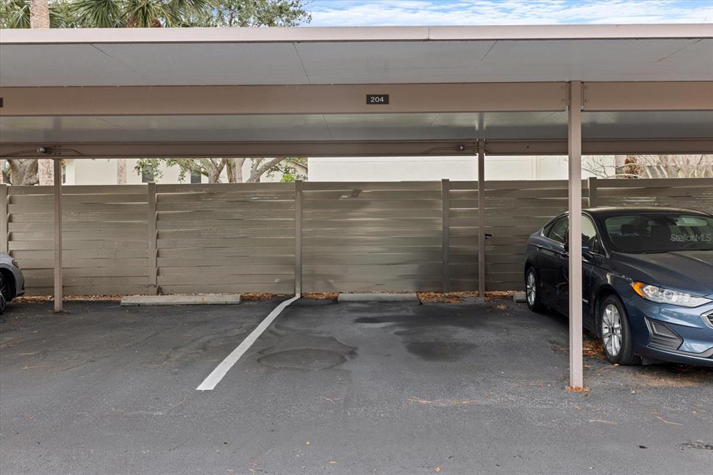 748 White Pine Tree Road, Unit 204 Venice, FL 34285 - Photo 34 of 48 a view of a garage with car