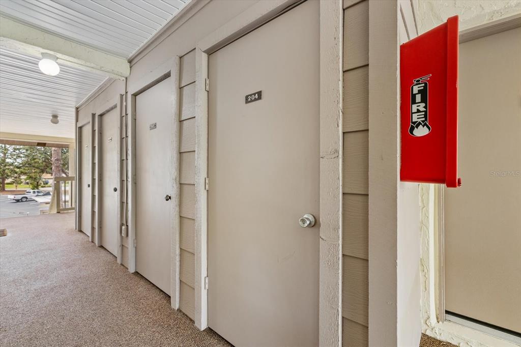 748 White Pine Tree Road, Unit 204 Venice, FL 34285 - Photo 37 of 48 a view of an entryway with a hallway