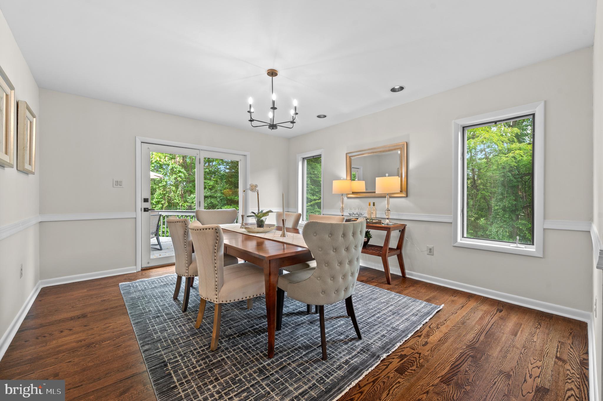 412 Hidden Valley Road Media, PA 19063 - Photo 13 of 51 a view of a dining room with furniture a rug and wooden floor