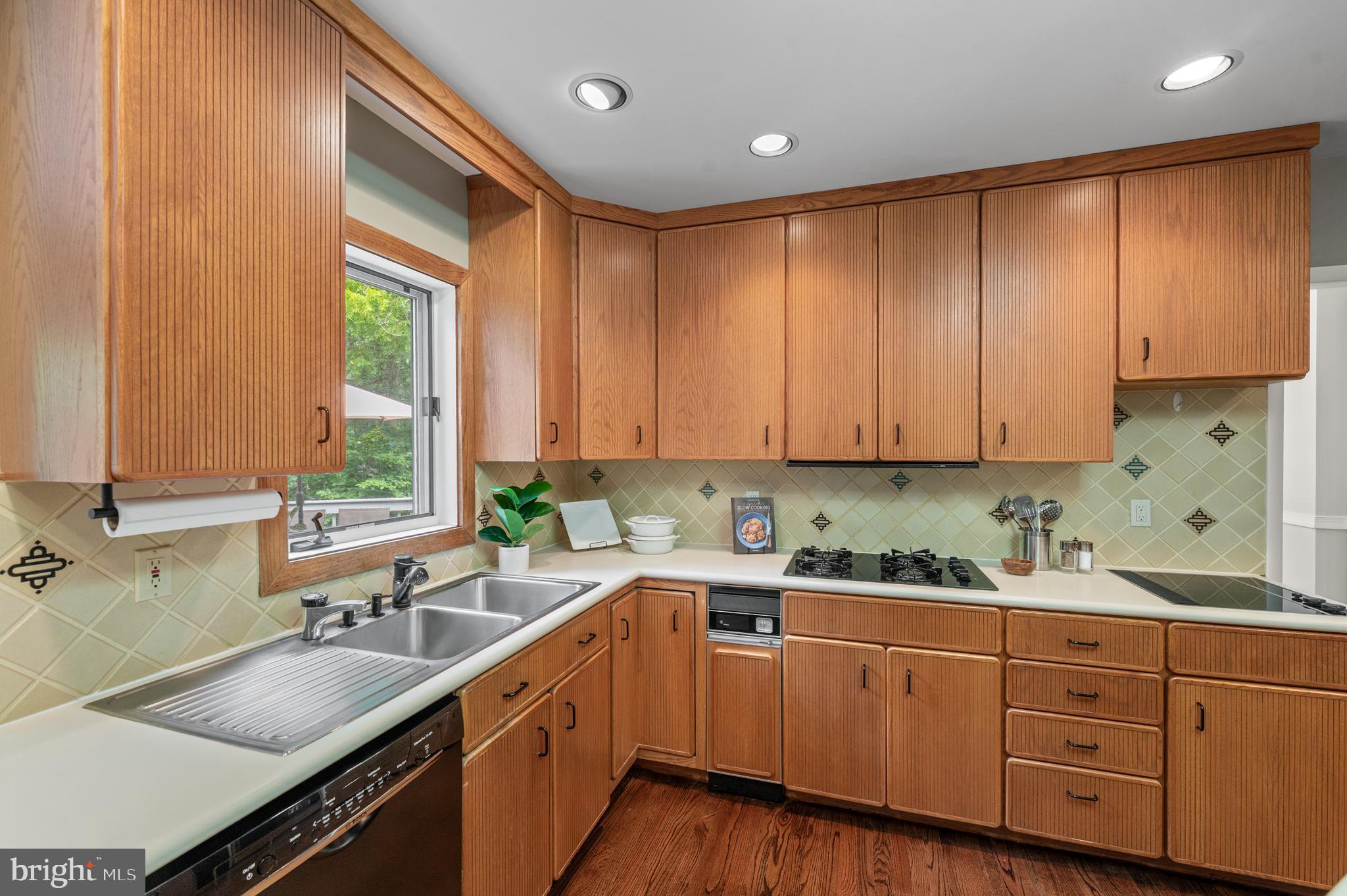 412 Hidden Valley Road Media, PA 19063 - Photo 18 of 51 a kitchen with kitchen island granite countertop a sink window and cabinets