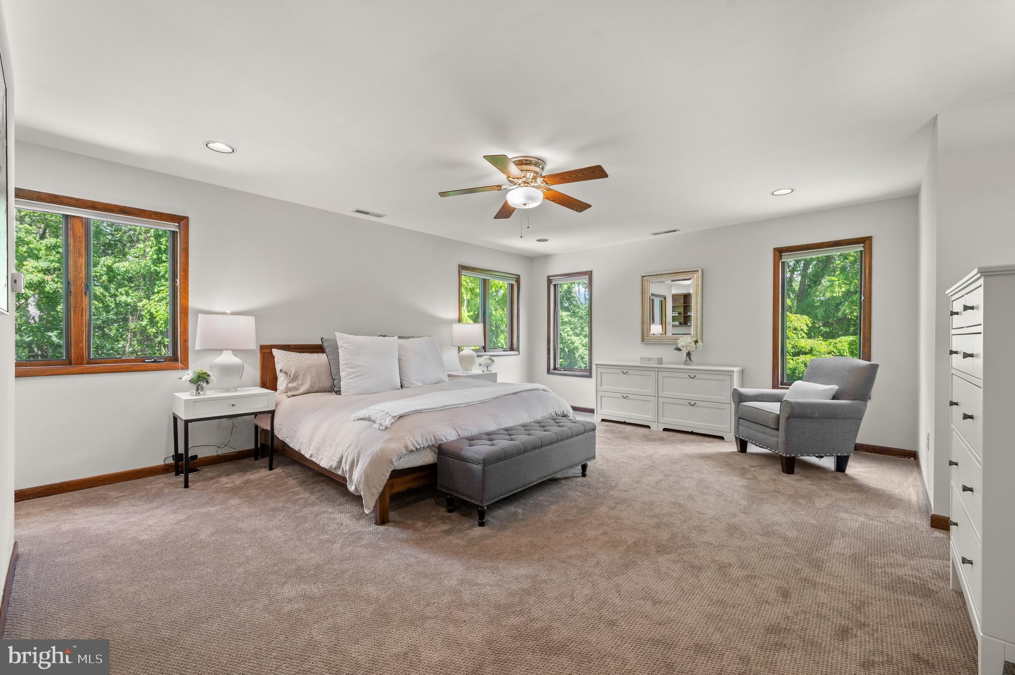 412 Hidden Valley Road Media, PA 19063 - Photo 26 of 51 a spacious bedroom with a bed and a chandelier