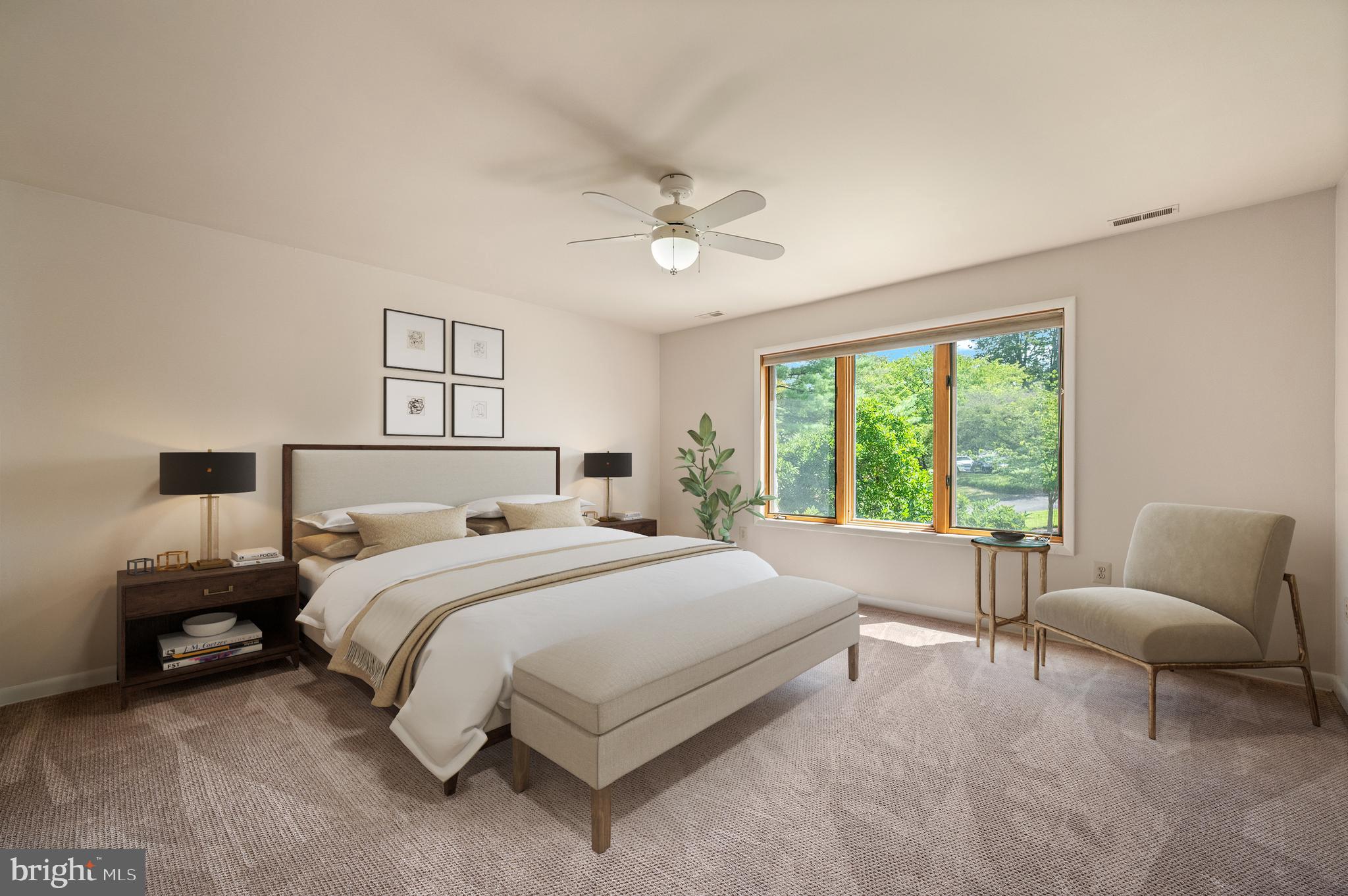 412 Hidden Valley Road Media, PA 19063 - Photo 34 of 51 a bedroom with a bed a couch and a large window