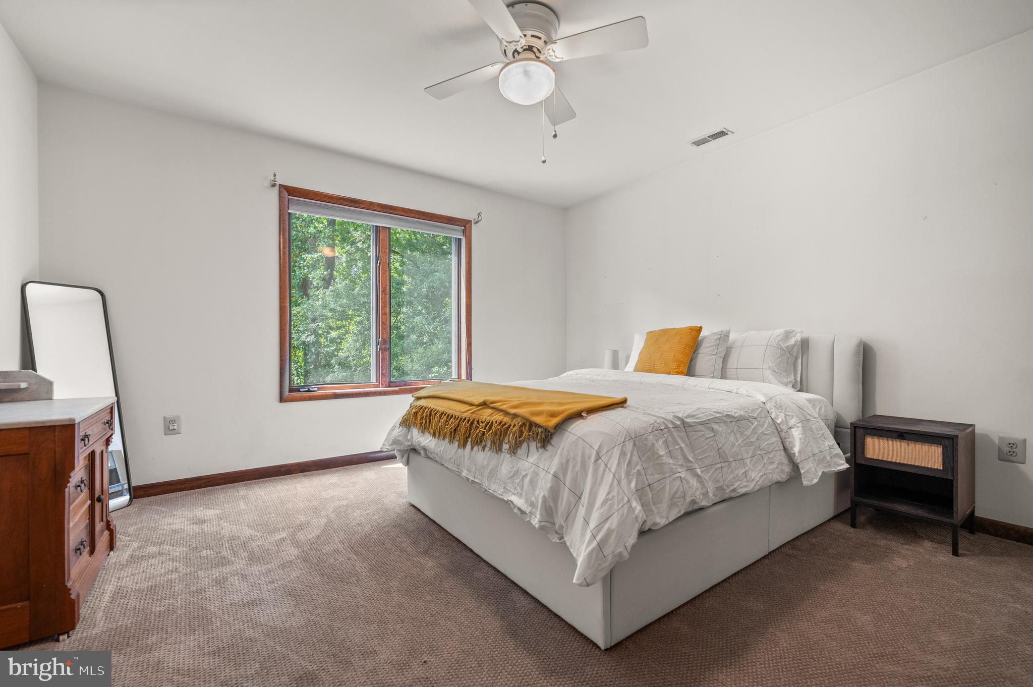 412 Hidden Valley Road Media, PA 19063 - Photo 38 of 51 a spacious bedroom with a bed and a window