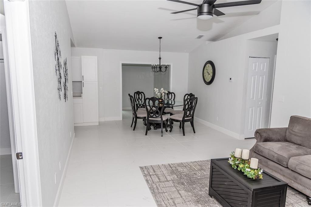 131 22nd Street Northeast Naples, FL 34120 - Photo 12 of 34 a living room with furniture and a window