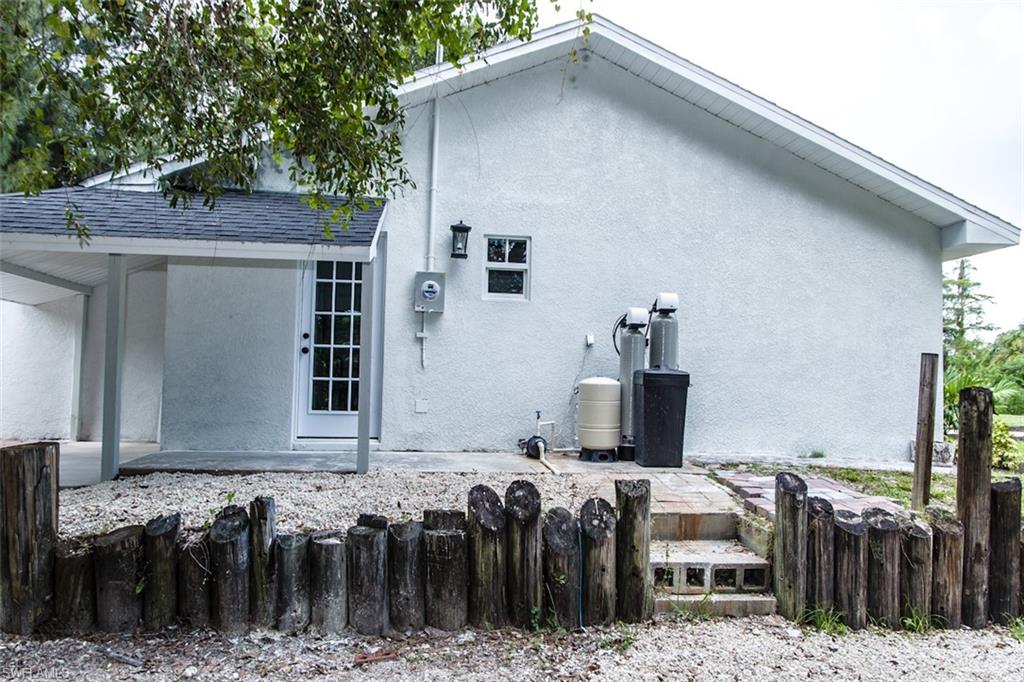 131 22nd Street Northeast Naples, FL 34120 - Photo 34 of 34 a front view of a house with a garage