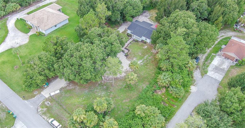 131 22nd Street Northeast Naples, FL 34120 - Photo 5 of 34 an aerial view of residential house with outdoor space and trees all around