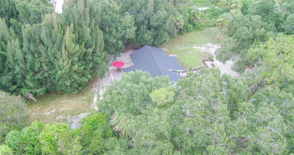 131 22nd Street Northeast Naples, FL 34120 - Photo 6 of 34 an aerial view of residential house with outdoor space and trees around