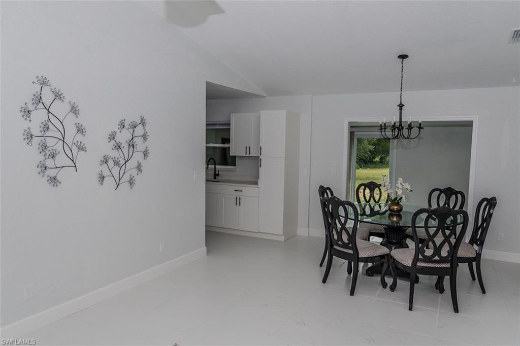 131 22nd Street Northeast Naples, FL 34120 - Photo 10 of 34 a view of a dining room with furniture