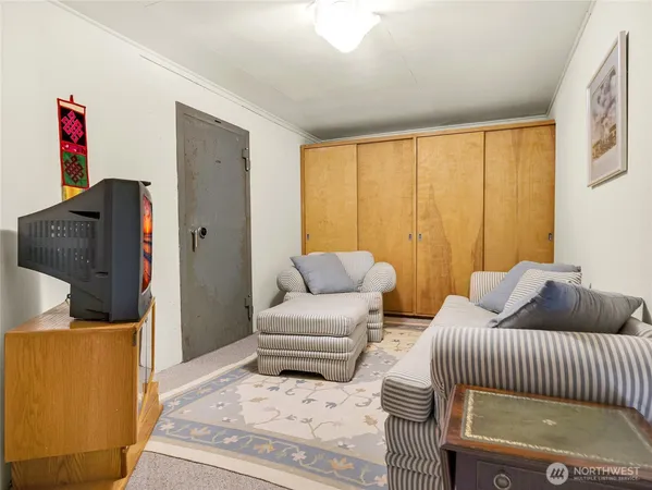 a bedroom with furniture and a window