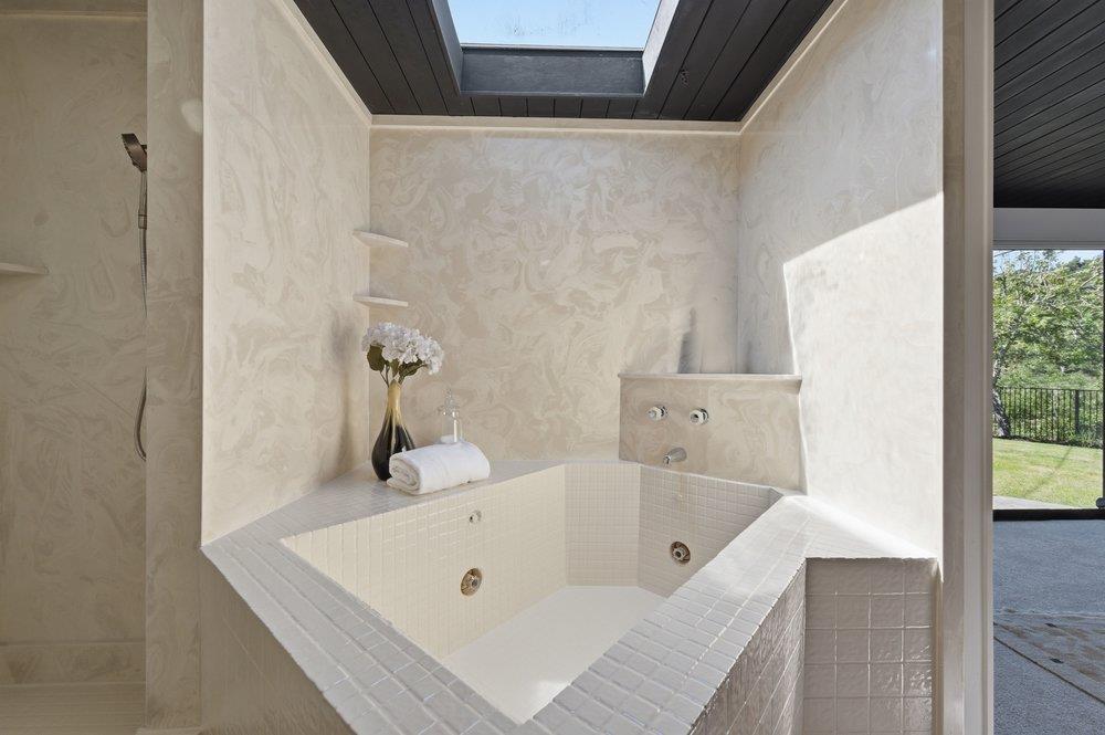 2203 Allegheny Way San Mateo, CA 94402 - Photo 23 of 56 a bath tub sitting next to a white sink