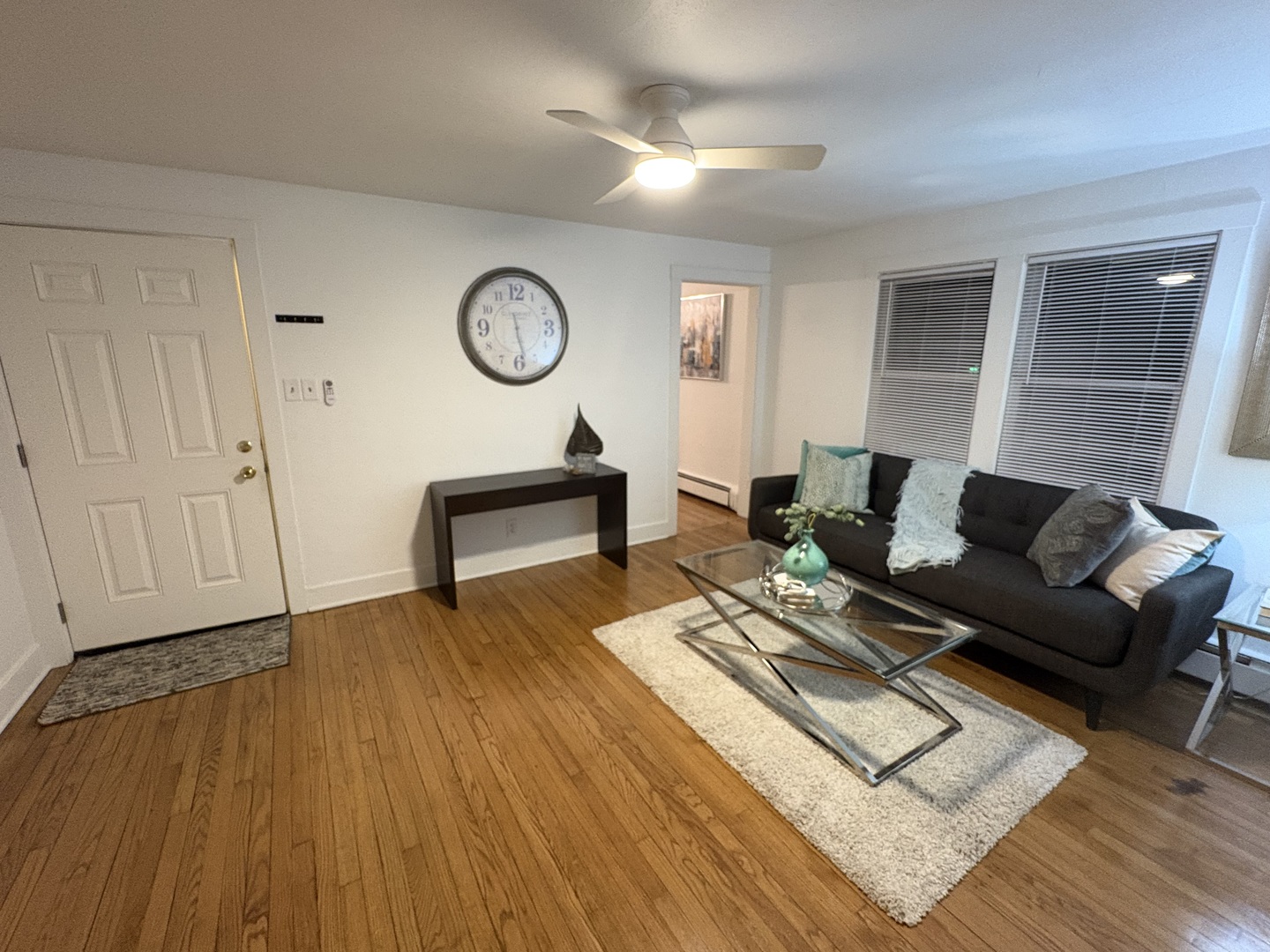 116 North 9th Street DeKalb, IL 60115 - Photo 8 of 20 a living room with furniture and a wooden floor