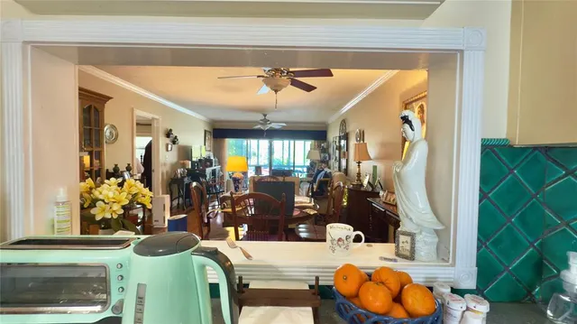 a view of living room with furniture and flowers