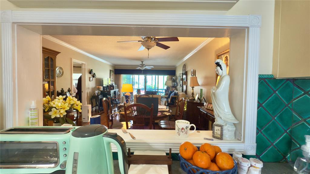 1200 Southwest 12th Court, Unit 305 Fort Lauderdale, FL 33315 - Photo 12 of 29 a view of living room with furniture and flowers