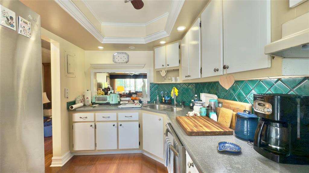 1200 Southwest 12th Court, Unit 305 Fort Lauderdale, FL 33315 - Photo 14 of 29 a kitchen with stainless steel appliances granite countertop a sink and cabinets