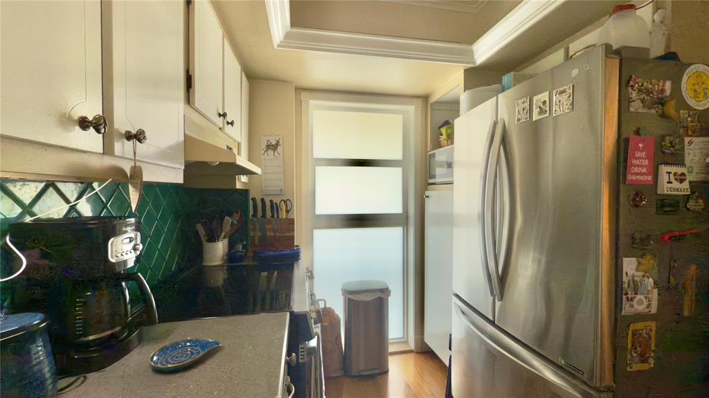 1200 Southwest 12th Court, Unit 305 Fort Lauderdale, FL 33315 - Photo 15 of 29 a kitchen with stainless steel appliances granite countertop a refrigerator and a stove
