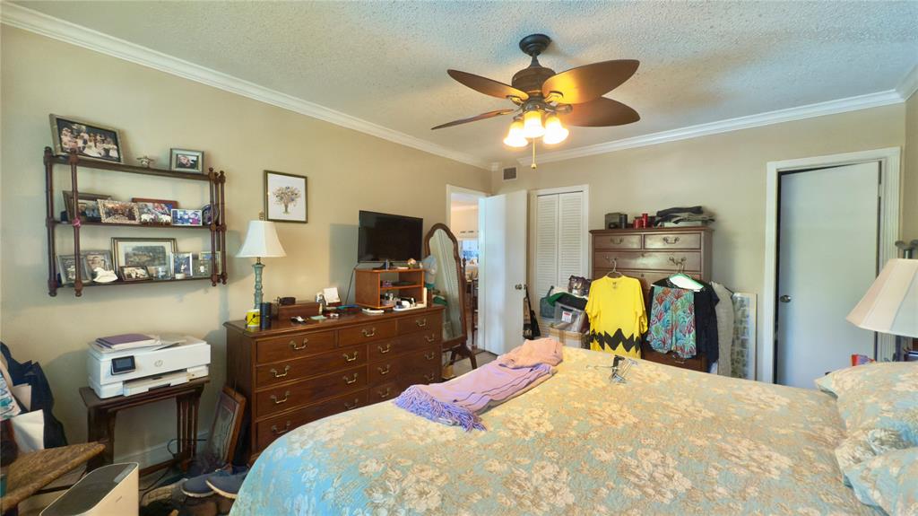 1200 Southwest 12th Court, Unit 305 Fort Lauderdale, FL 33315 - Photo 7 of 29 a bedroom with a bed and a flat tv screen on dresser