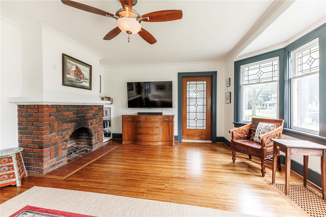 55 Elm Drive Rochester, NY 14609 - Photo 4 of 31 Pocket door from Foyer into the Living Room with wood burning fireplace