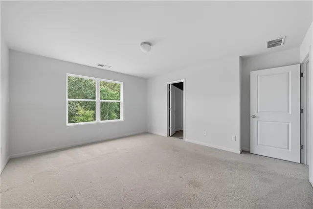 a bathroom with a double vanity sink and mirror