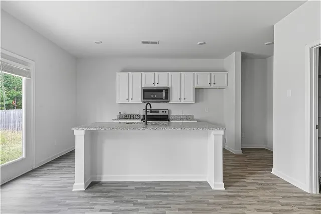 a view of kitchen with wooden floor