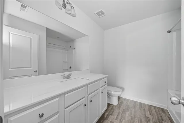 a bathroom with a tub and shower