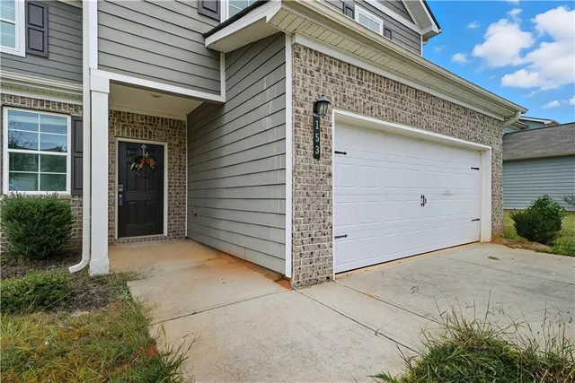 an aerial view of a house with outdoor space