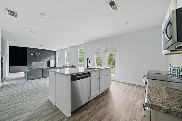 a living room with furniture and a window
