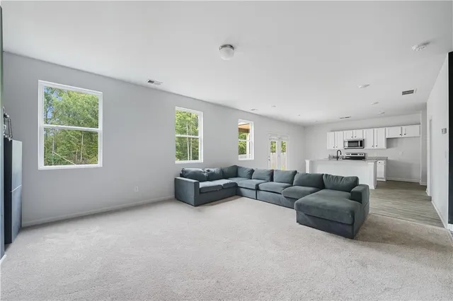 a living room with furniture and a couch