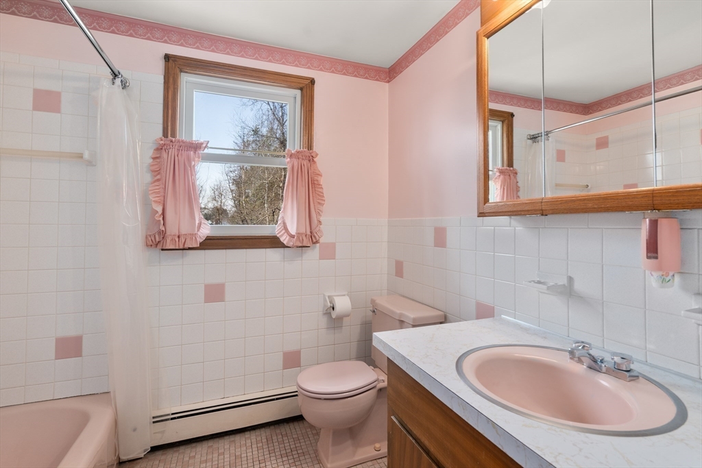 4 Jeffrey Road Canton, MA 02021 - Photo 13 of 26 a bathroom with a toilet a sink and mirror