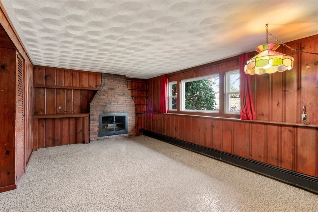4 Jeffrey Road Canton, MA 02021 - Photo 14 of 26 a view of an empty room with wooden floor and a window