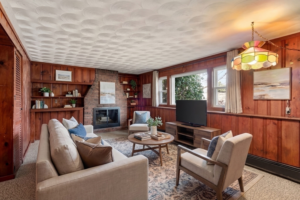 4 Jeffrey Road Canton, MA 02021 - Photo 15 of 26 a living room with fireplace furniture and a large window