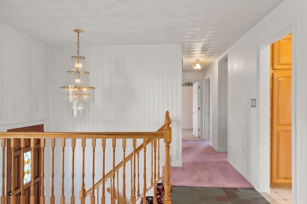 4 Jeffrey Road Canton, MA 02021 - Photo 2 of 26 a view of a hallway to room with wooden floor and windows