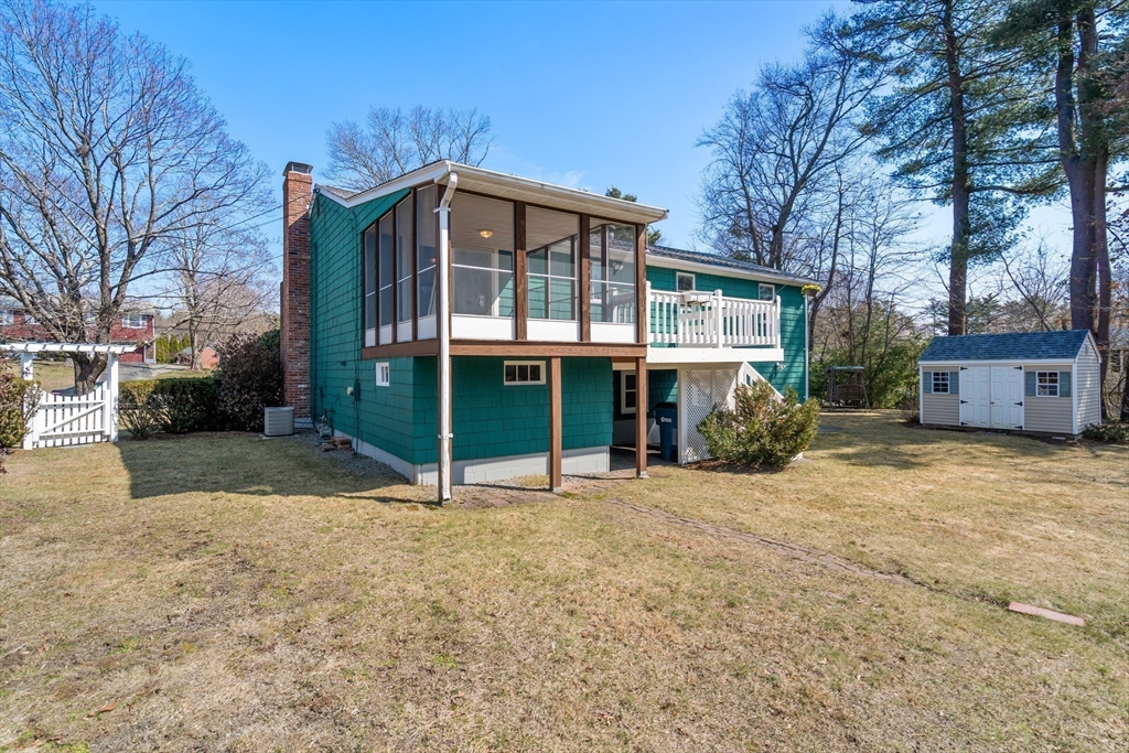 4 Jeffrey Road Canton, MA 02021 - Photo 23 of 26 a view of a house with a yard