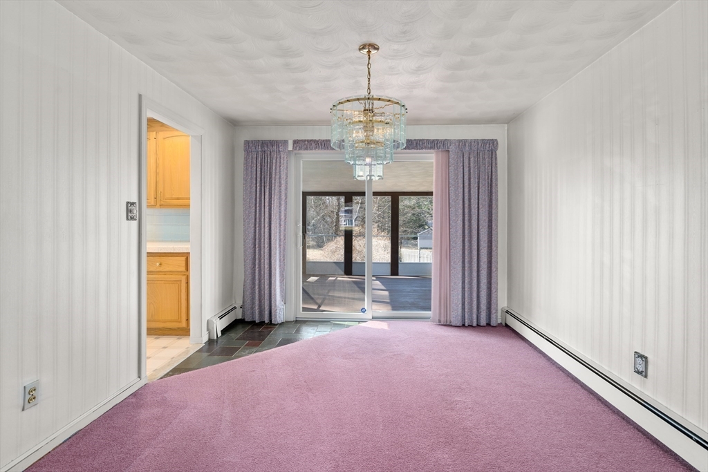4 Jeffrey Road Canton, MA 02021 - Photo 6 of 26 a view of a room with large windows and chandelier