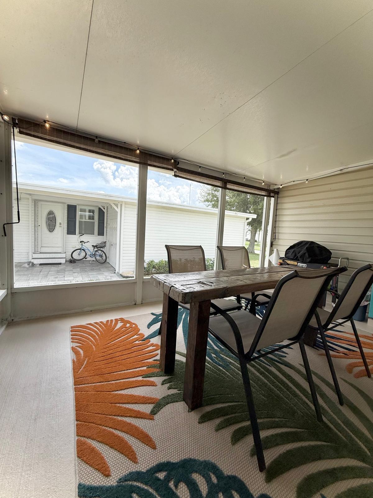 223 Sea Conch Place, Unit 14 Fort Pierce, FL 34982 - Photo 11 of 28 a view of a dining room with furniture and window