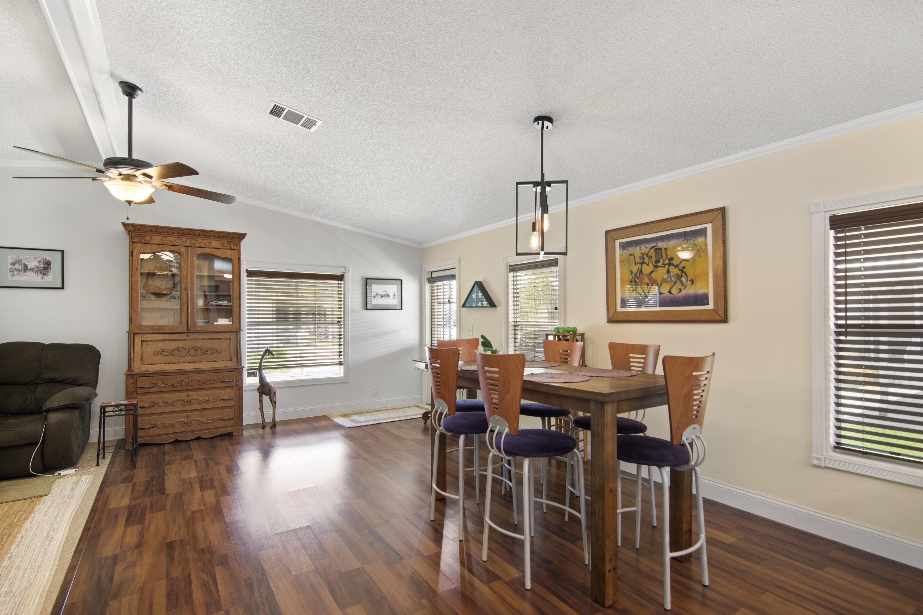 223 Sea Conch Place, Unit 14 Fort Pierce, FL 34982 - Photo 14 of 28 a view of a dining room with furniture window and wooden floor