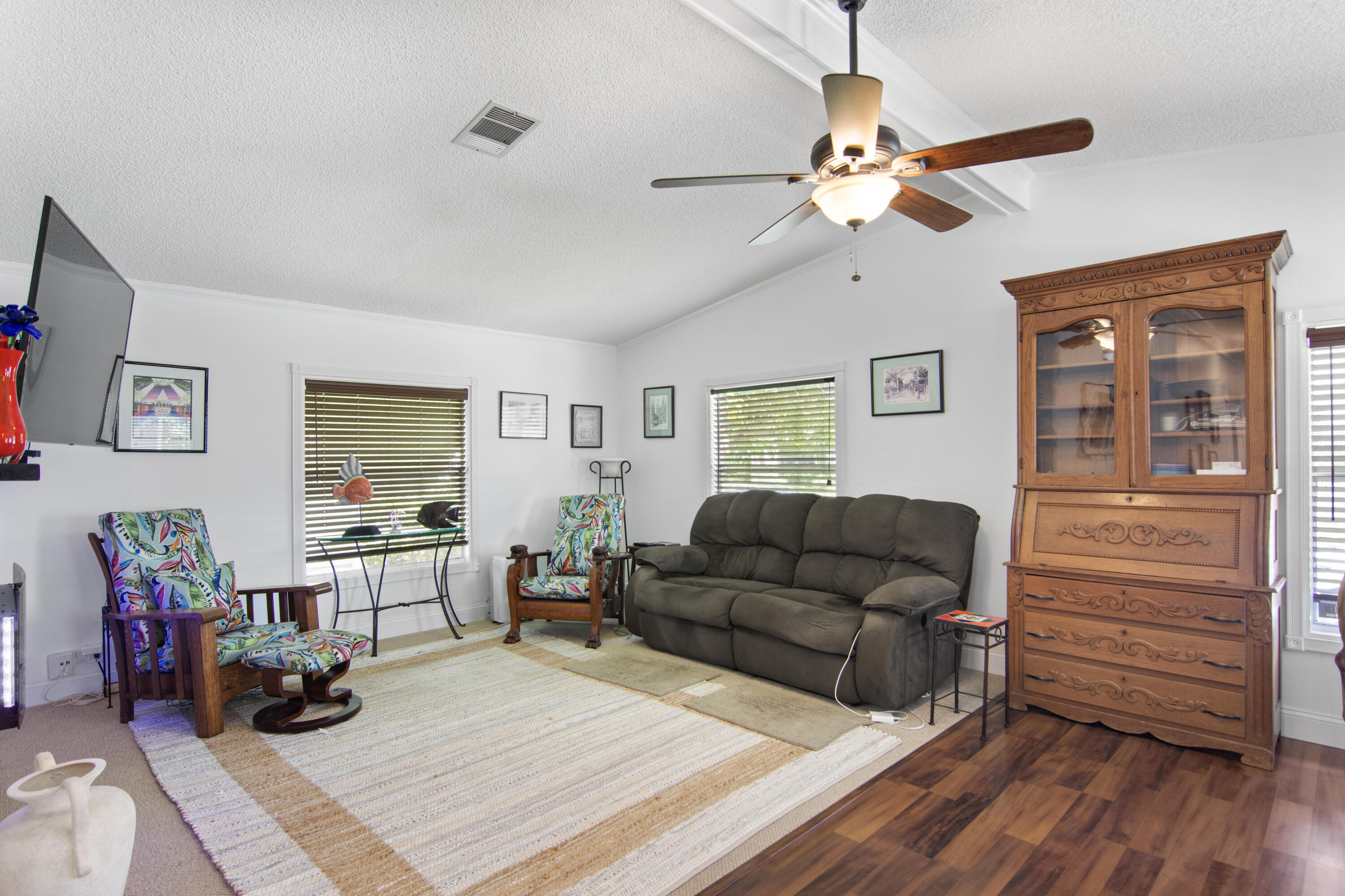 223 Sea Conch Place, Unit 14 Fort Pierce, FL 34982 - Photo 16 of 28 a living room with furniture and wooden floor