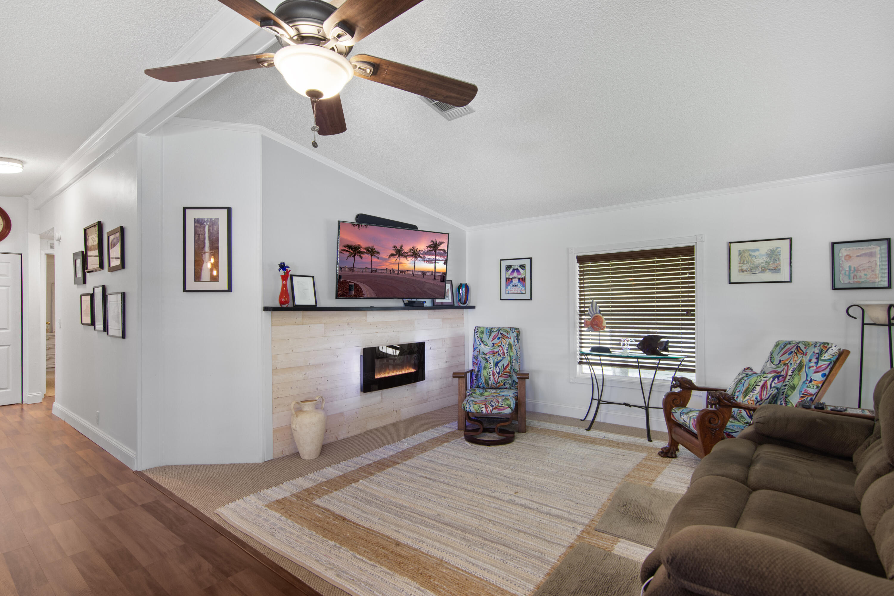 223 Sea Conch Place, Unit 14 Fort Pierce, FL 34982 - Photo 17 of 28 a living room with furniture and a flat screen tv