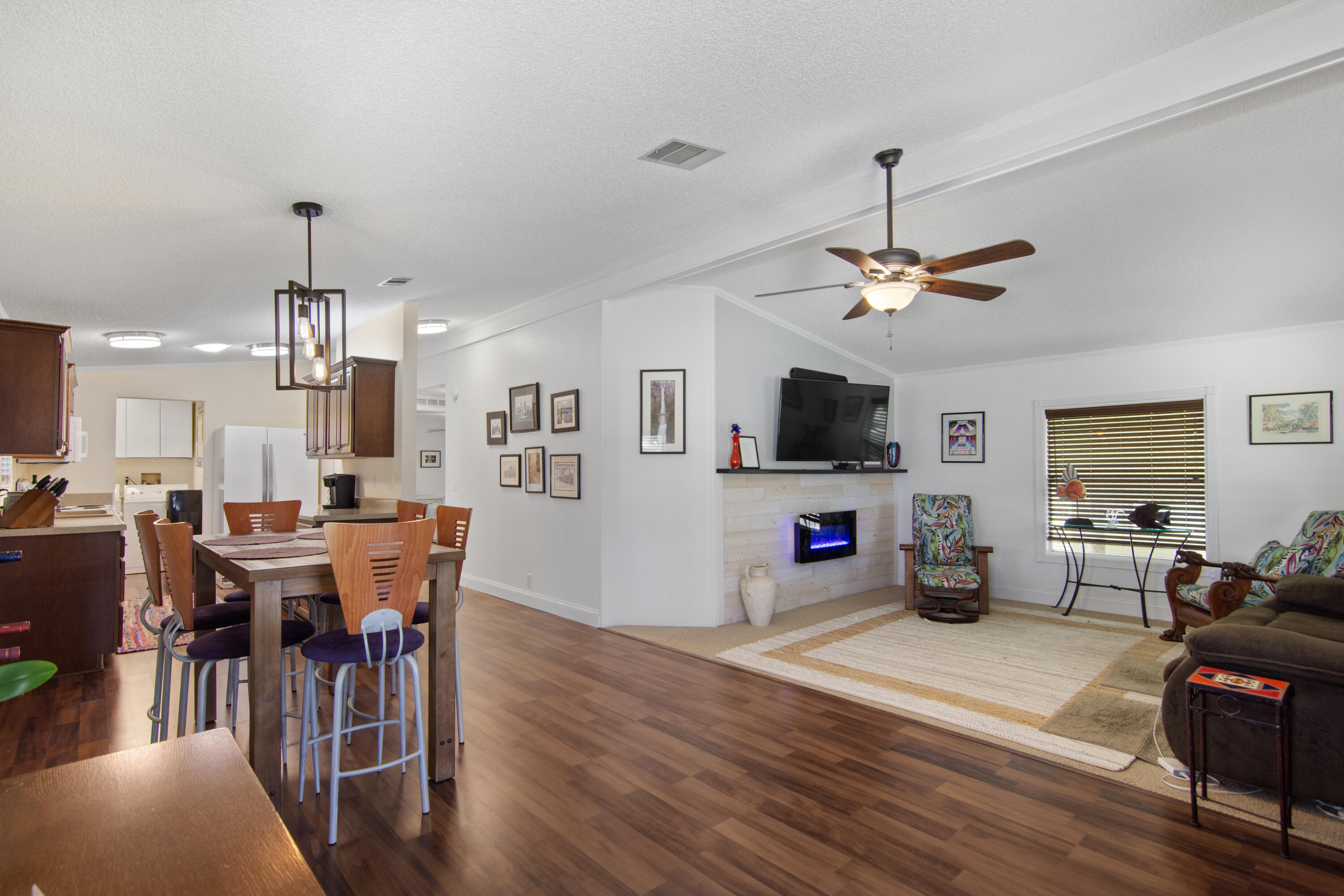 223 Sea Conch Place, Unit 14 Fort Pierce, FL 34982 - Photo 18 of 28 a view of a dining room with furniture window and wooden floor