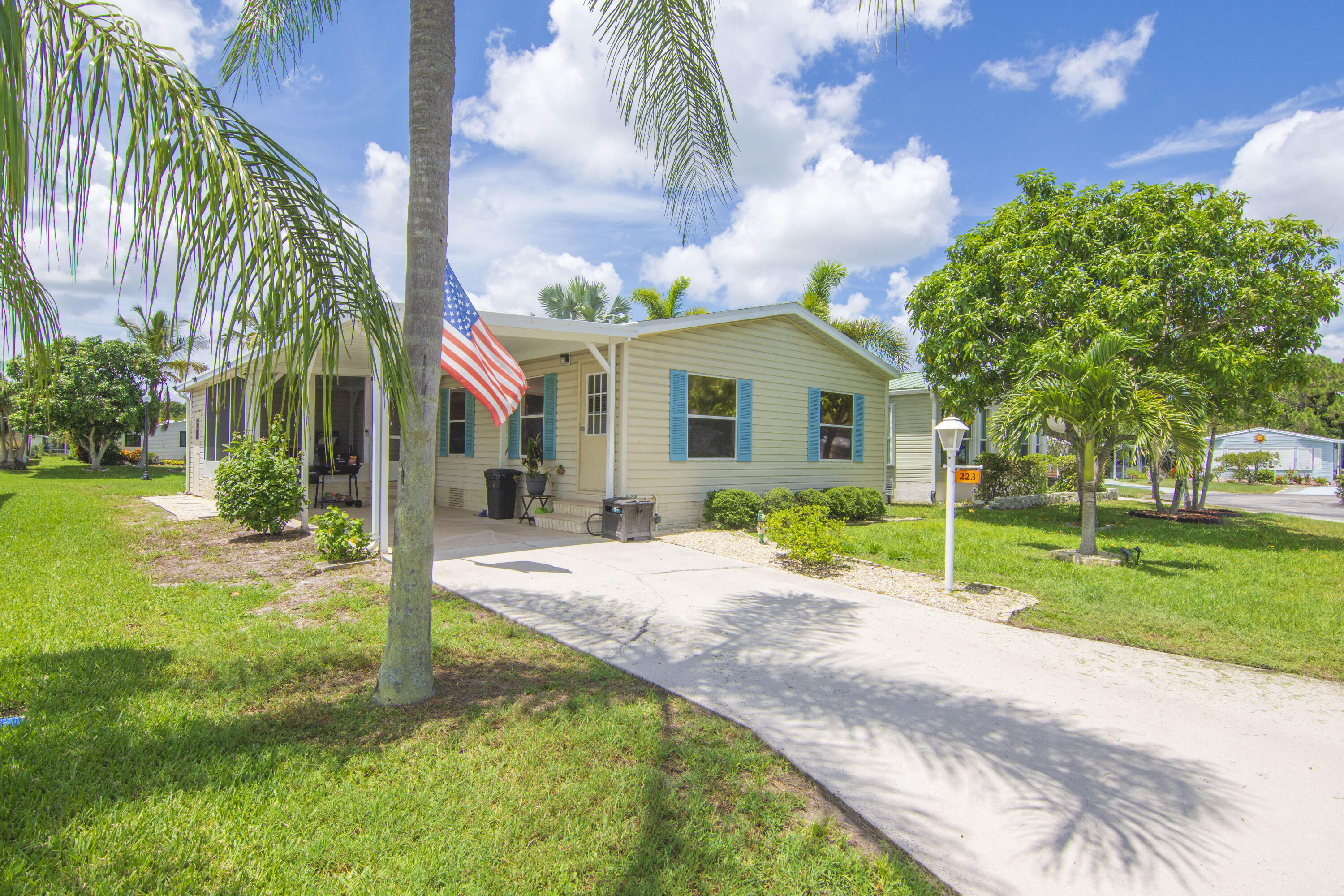 223 Sea Conch Place, Unit 14 Fort Pierce, FL 34982 - Photo 2 of 28 a front view of house with yard and green space