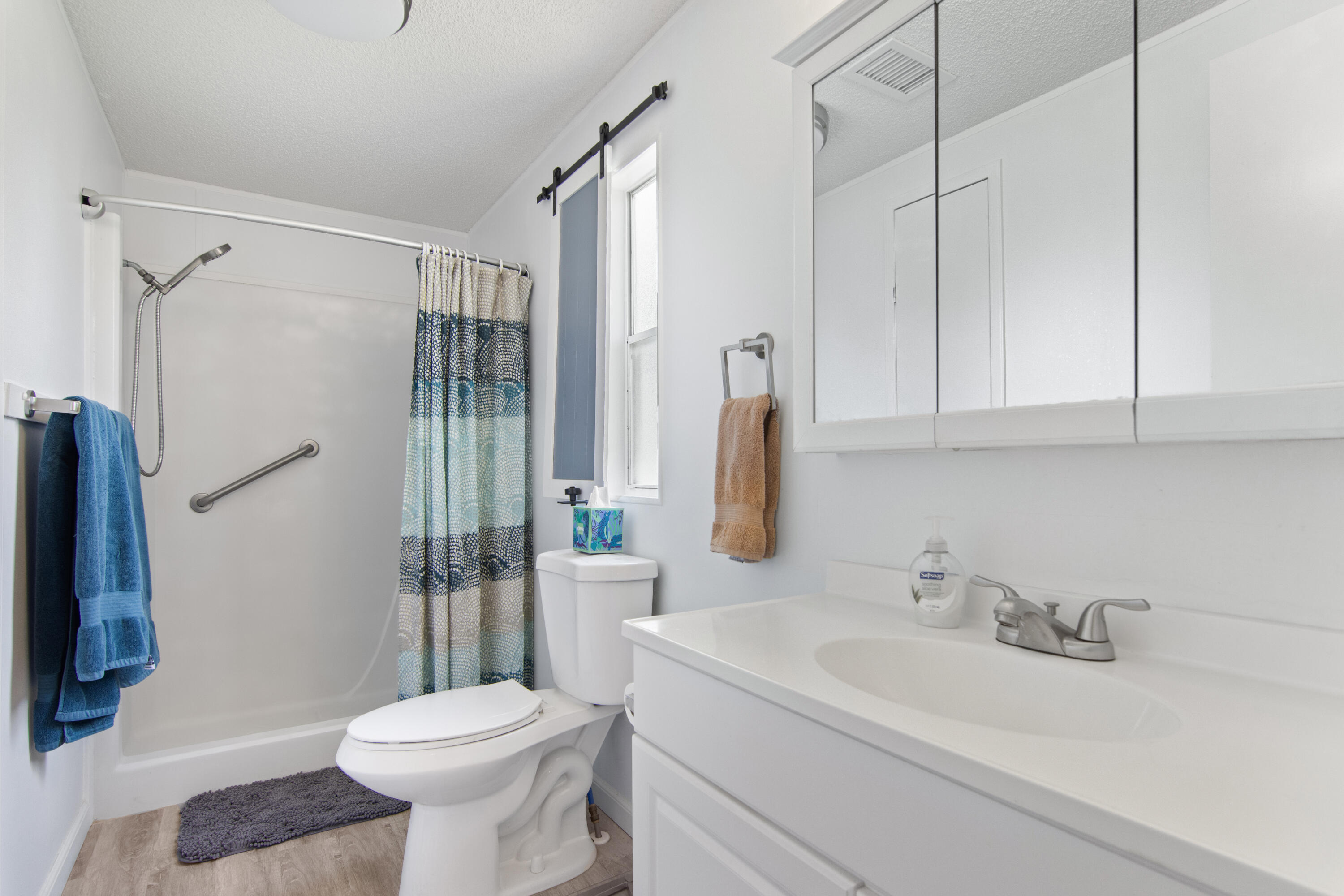 223 Sea Conch Place, Unit 14 Fort Pierce, FL 34982 - Photo 26 of 28 a bathroom with a sink toilet and shower