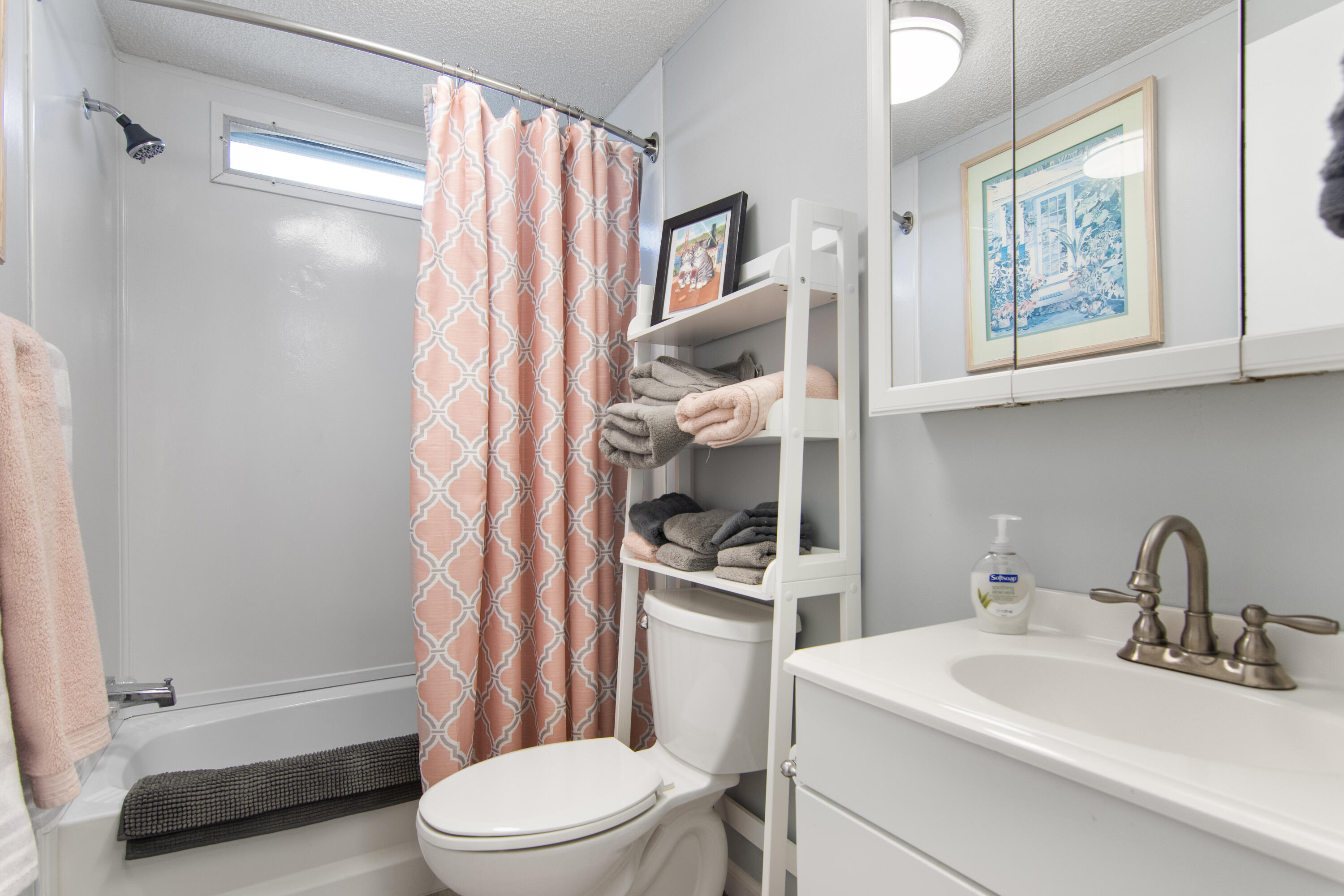 223 Sea Conch Place, Unit 14 Fort Pierce, FL 34982 - Photo 27 of 28 a bathroom with a sink toilet and shower