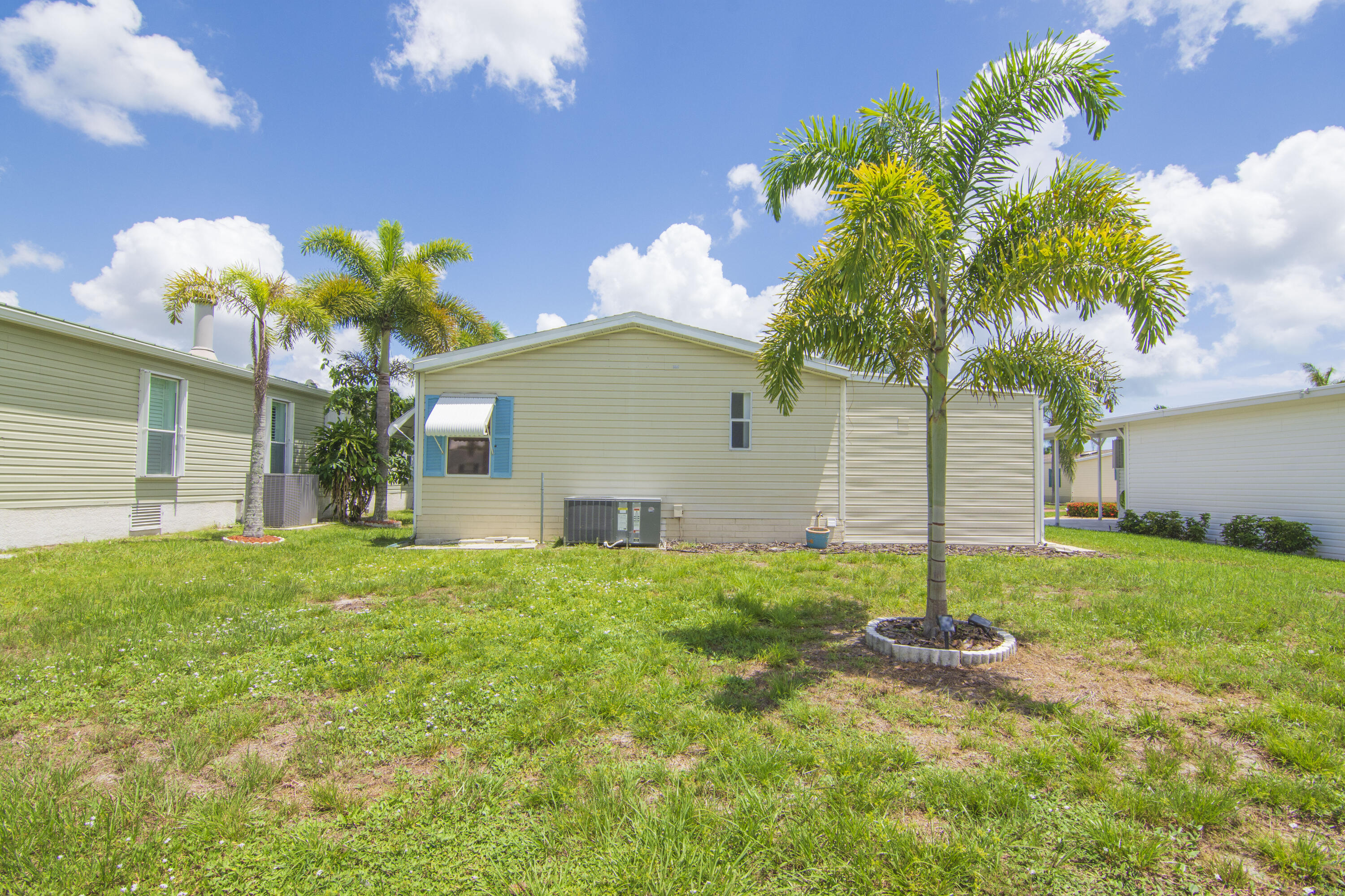 223 Sea Conch Place, Unit 14 Fort Pierce, FL 34982 - Photo 3 of 28 a front view of a house with garden