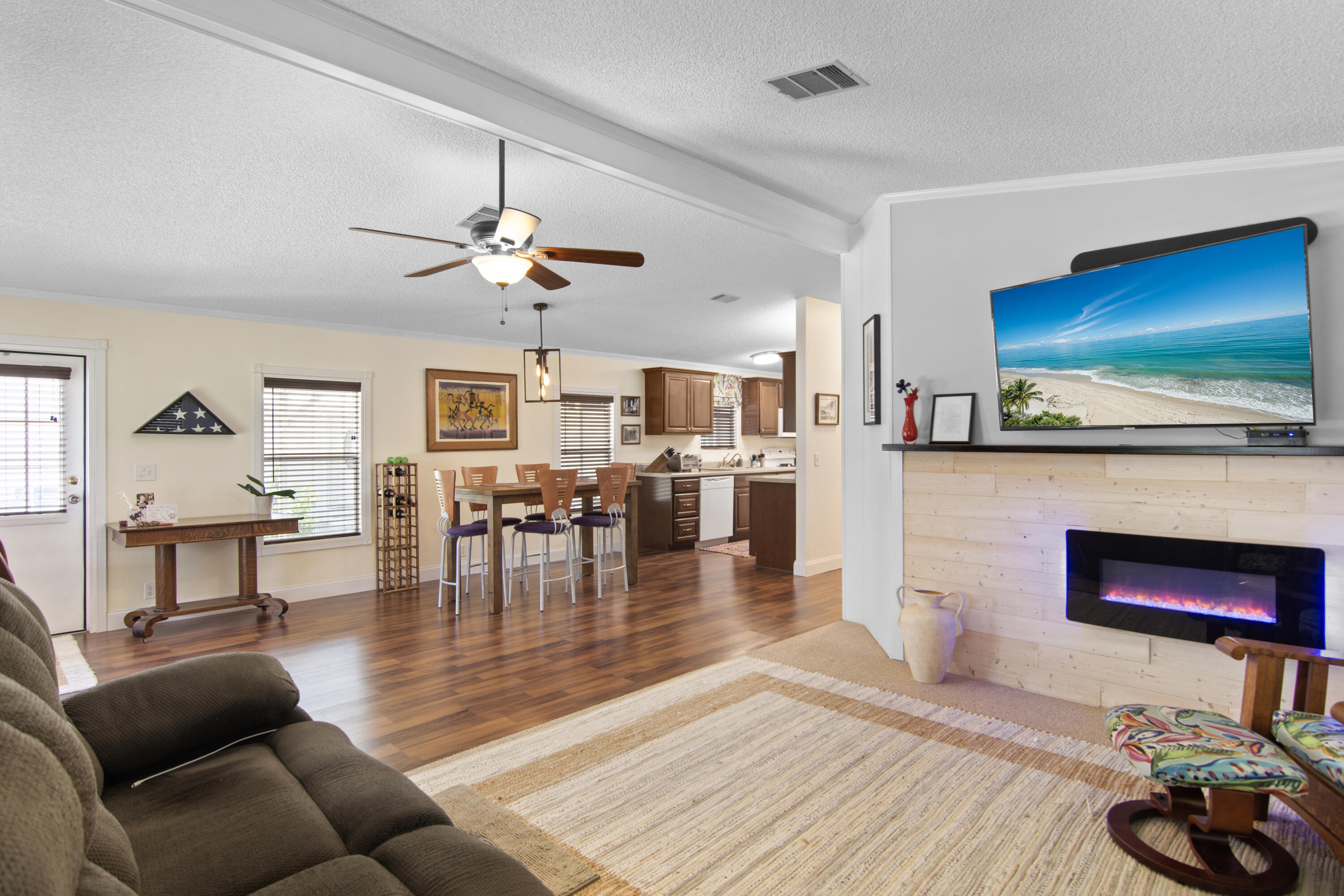 223 Sea Conch Place, Unit 14 Fort Pierce, FL 34982 - Photo 4 of 28 a living room with furniture and a flat screen tv