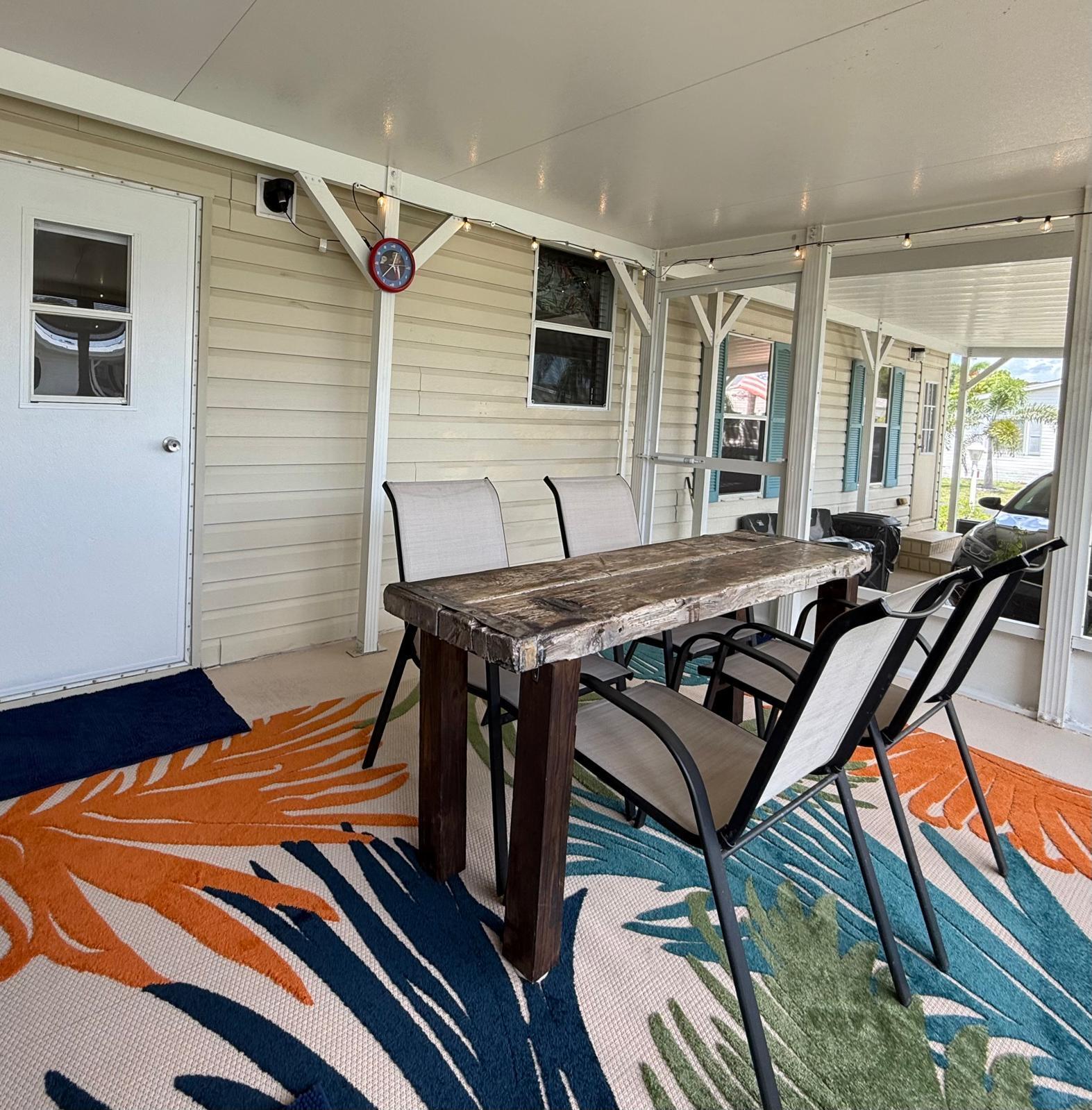 223 Sea Conch Place, Unit 14 Fort Pierce, FL 34982 - Photo 5 of 28 a bedroom with a bed and wooden floor