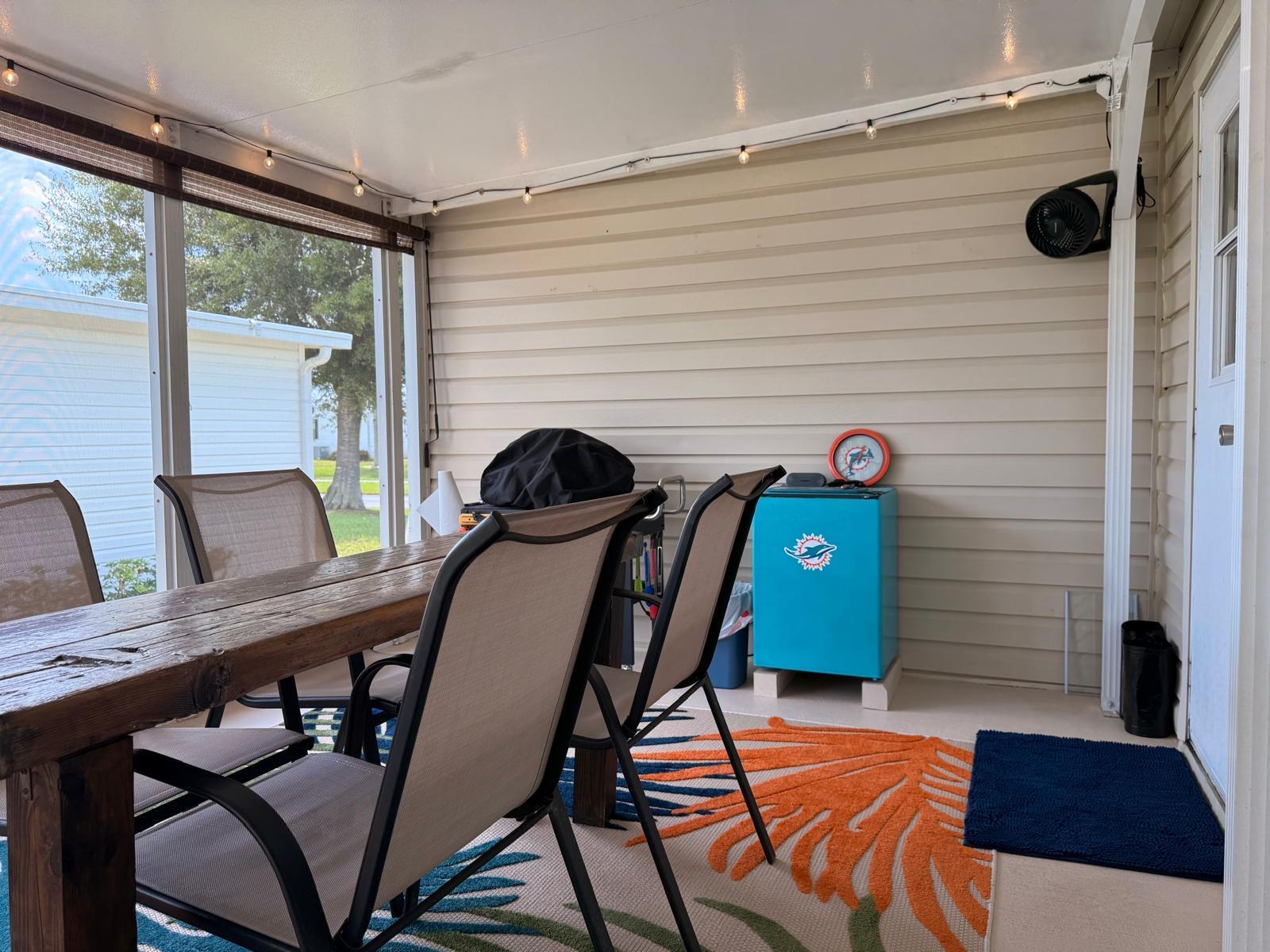 223 Sea Conch Place, Unit 14 Fort Pierce, FL 34982 - Photo 7 of 28 a view of a dining room with furniture and wooden floor